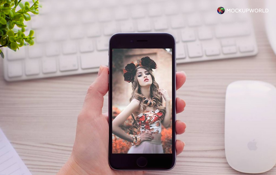 Hand Holding a Vertical iPhone Mockup, free design mockups